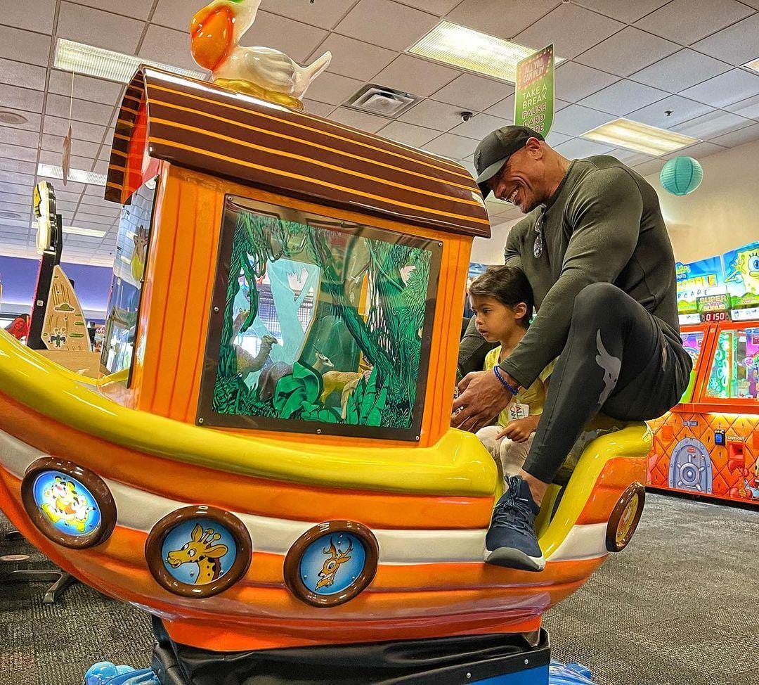 The Rock riding a Chuck E. Cheese ‘Jungle Cruise’ boat is everything
