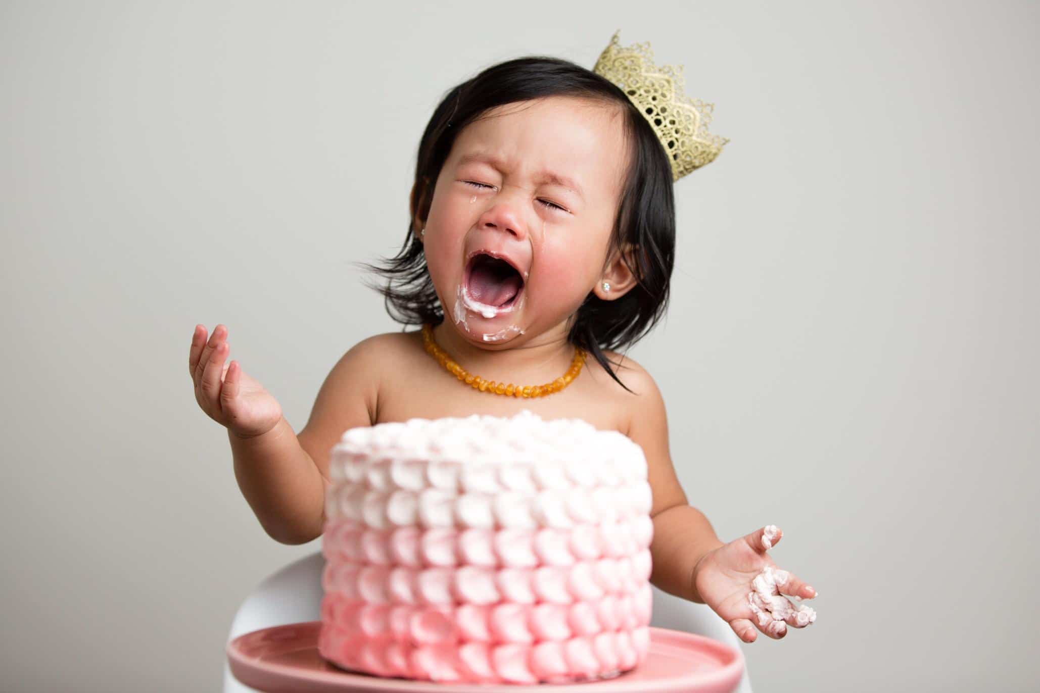 70+ Taurus-inspired baby names for babies born in April & May baby eating a cake- taurus baby names
