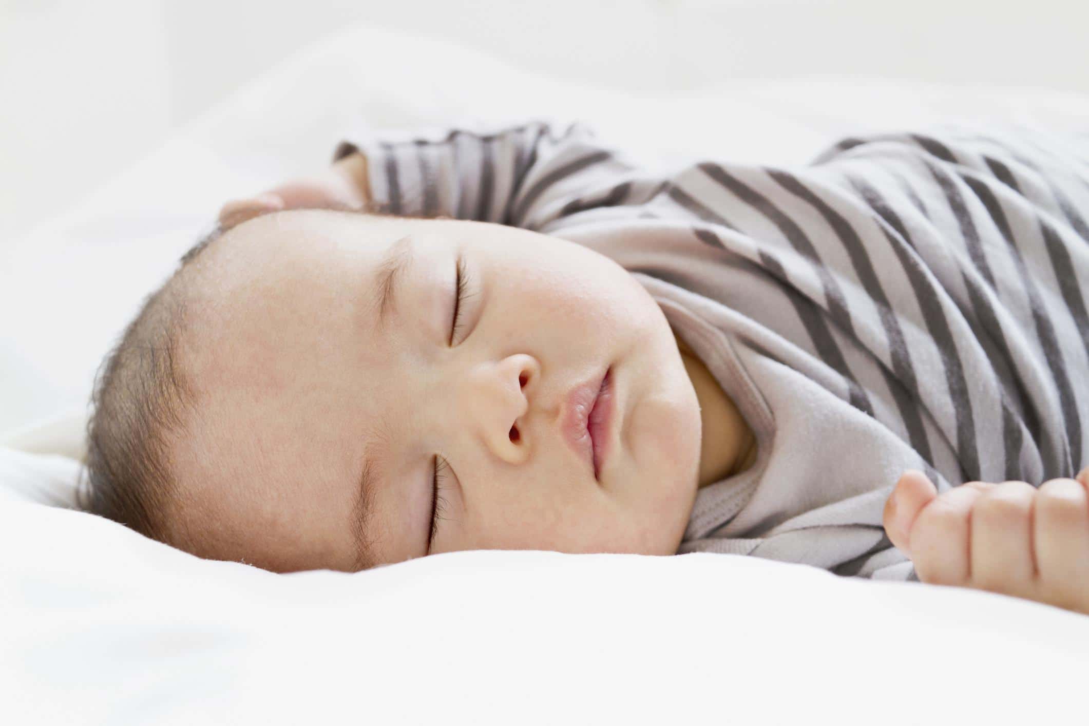 How much sleep does an eight-week-old baby need? eight-week-old baby sleeping on its back