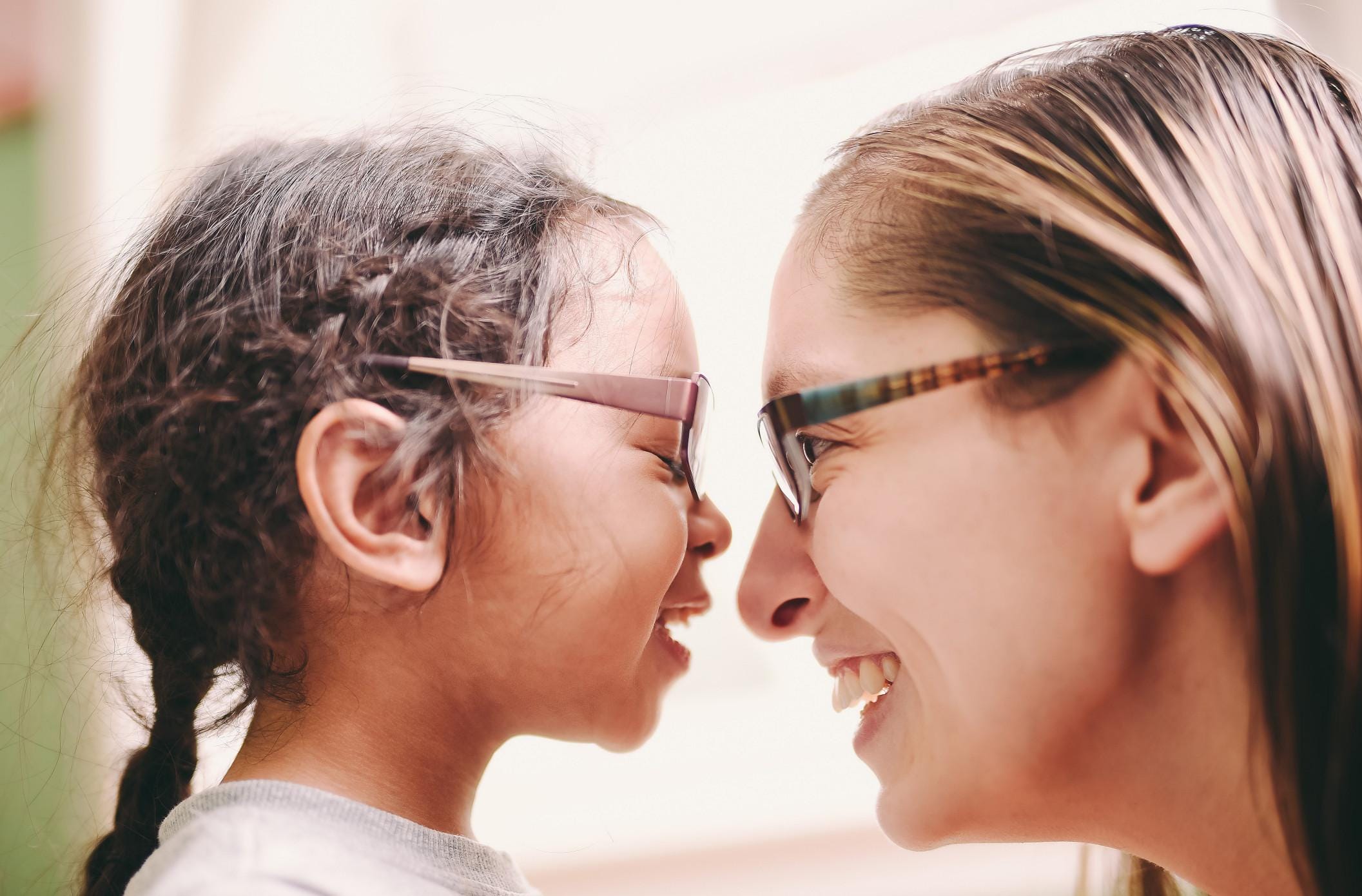12 positive phrases that motivate kids to do the right thing mom face-to-face smiling at daughter