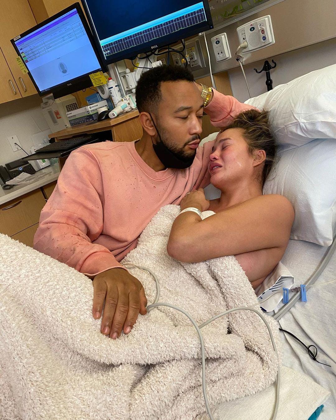 Chrissy Teigen shares heartbreaking photo one year after losing her baby Chrissy Teigen crying next to John Legend