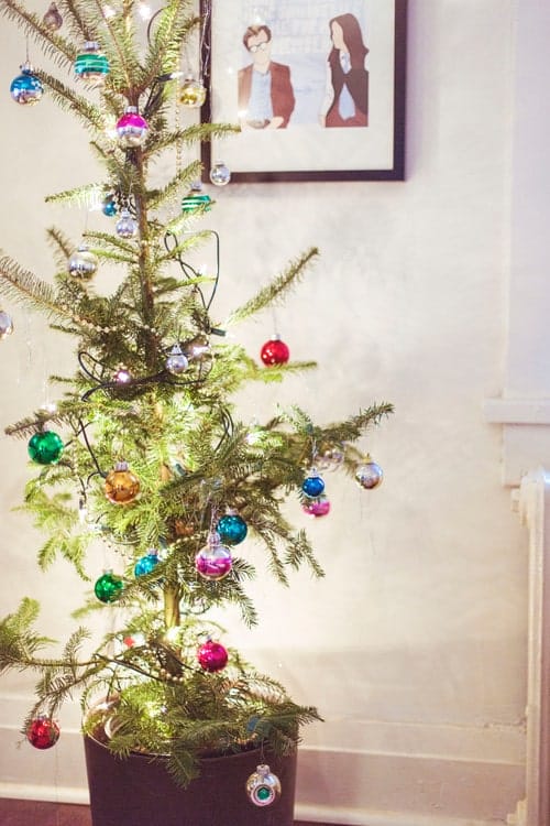 Merry + bright: 9 ways to have a simpler holiday simple holiday, sparsely decorated christmas tree