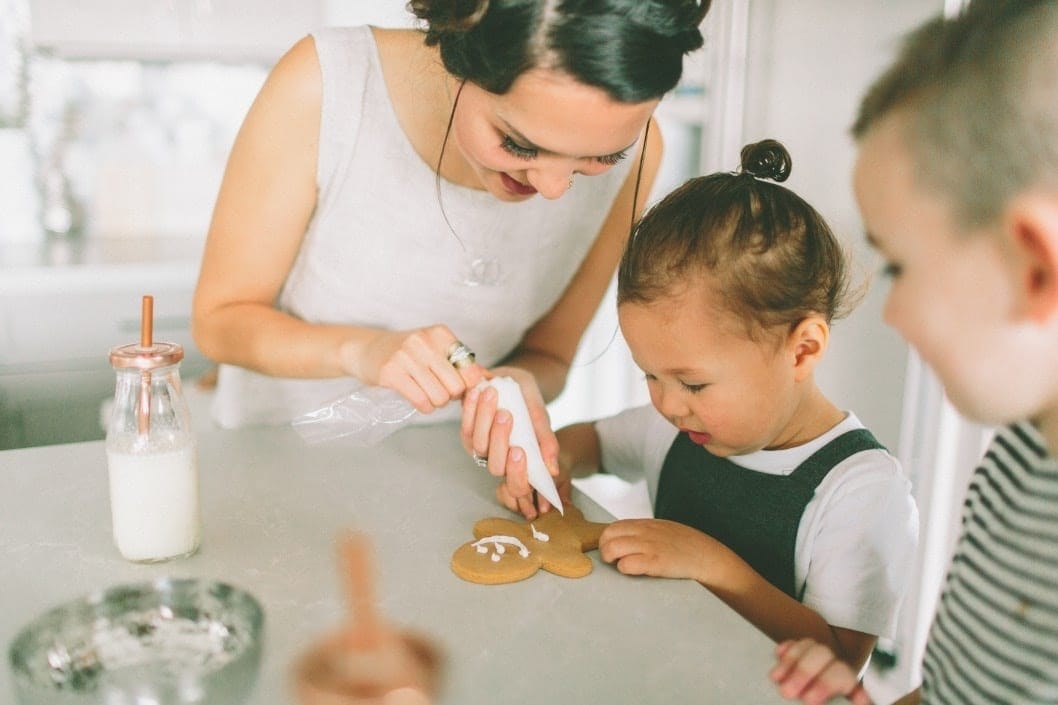 Dear mama—I know being the spirit of Christmas is exhausting mom and daughter decorating christmas cookies together- the spirit of christmas