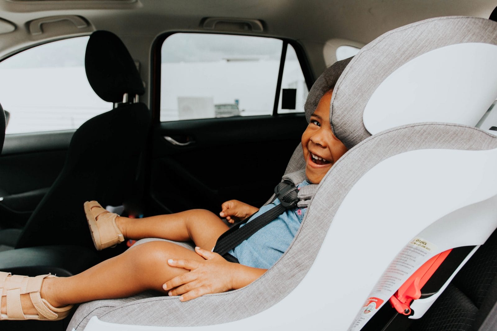 13 hacks to keep your car organized—from real mamas toddler laughing in a car seat