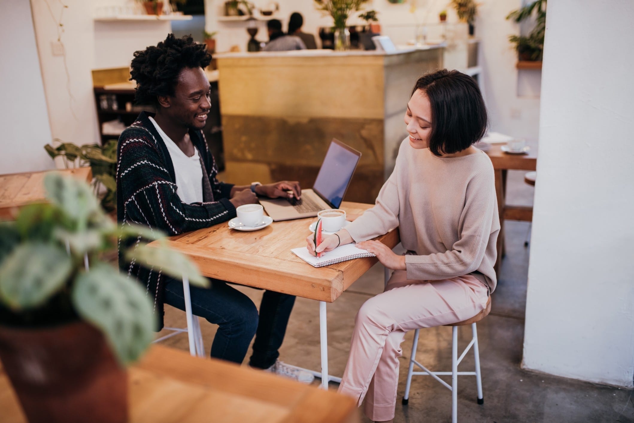 The 4 financial accounts all parents should have (and how to set them up in under 30 minutes) couple working on budget at a cafe - financial accounts parents need