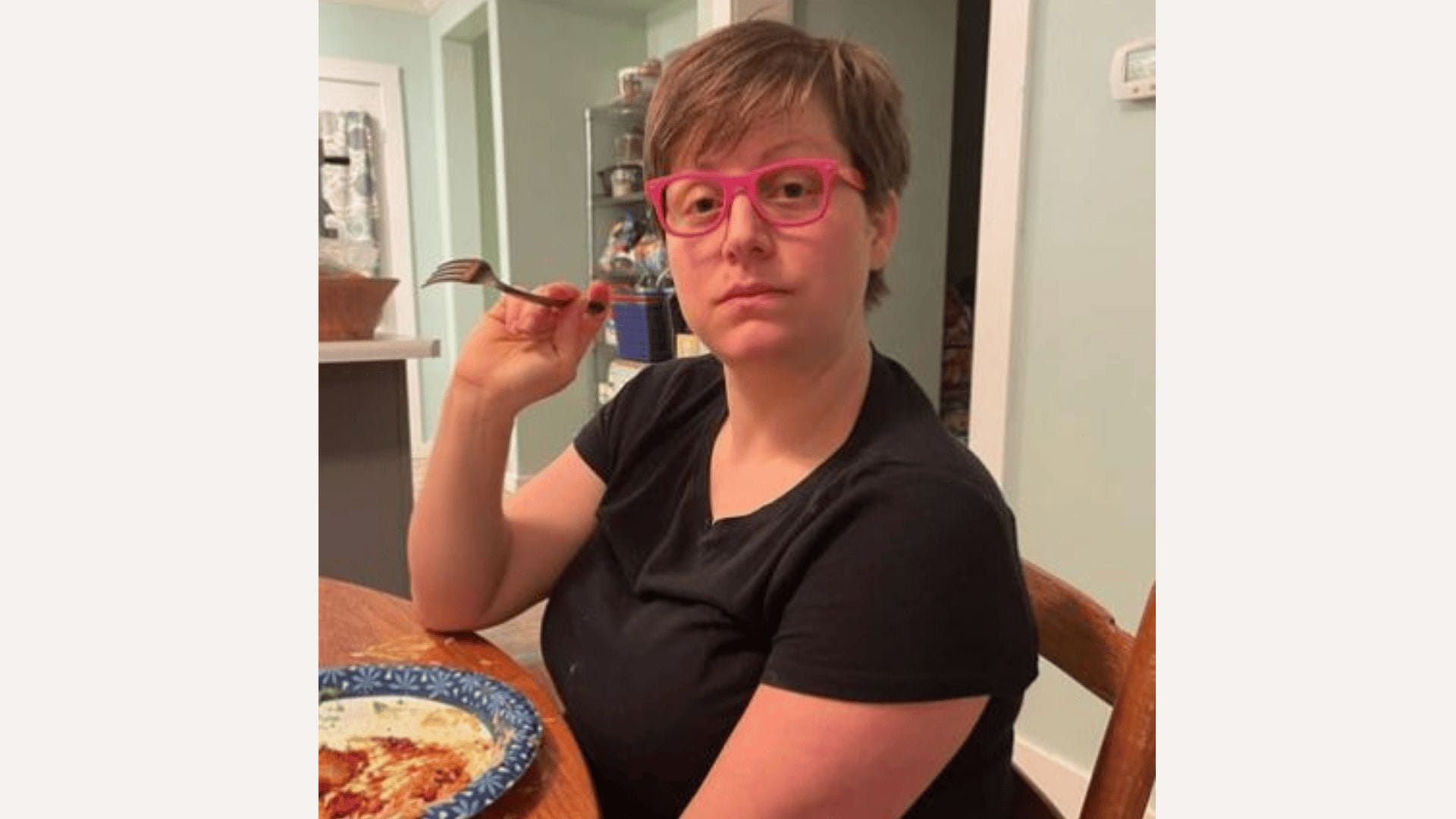 woman posing while eating dinner