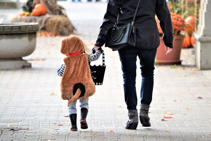 CDC urges families to skip trick-or-treating this Halloween parent and child trick or treating
