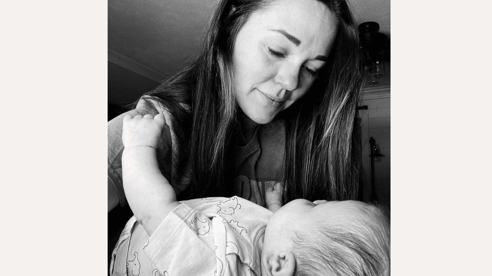 This mama perfectly explains how time changes when you become a mother black and white photo of mom looking at baby