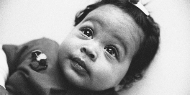 How to survive the four-month sleep regression little baby looking at mom
