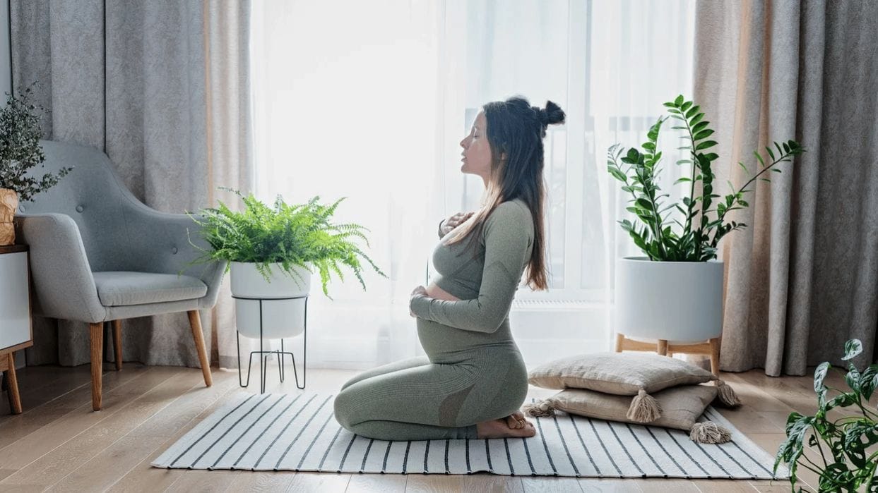 9 safe and simple pregnancy exercises for each trimester pregnant-woman-doing-yoga
