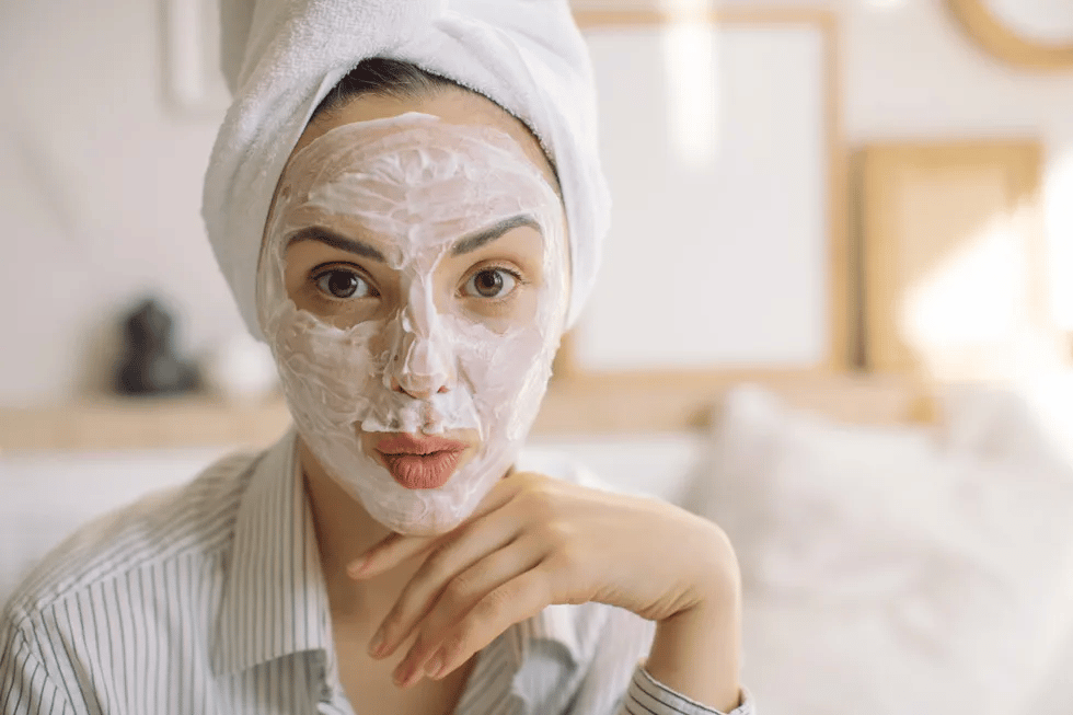 20+ pregnancy-safe skincare products (because that glow doesn’t always come naturally!) woman-with-towel-on-her-head-and-beauty-mask-on-face