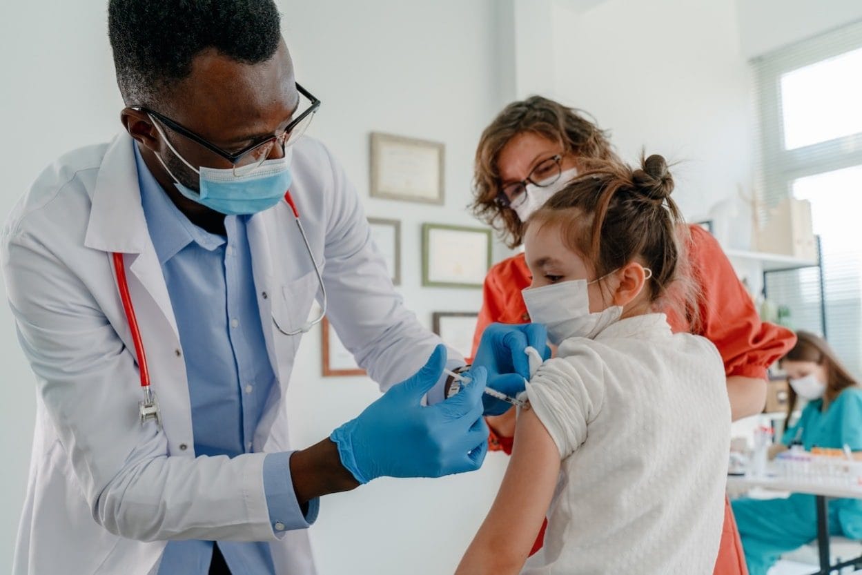 For these parents, getting their 5- to 11-year-olds vaccinated is a huge relief parents-watching-child-covid-vaccine