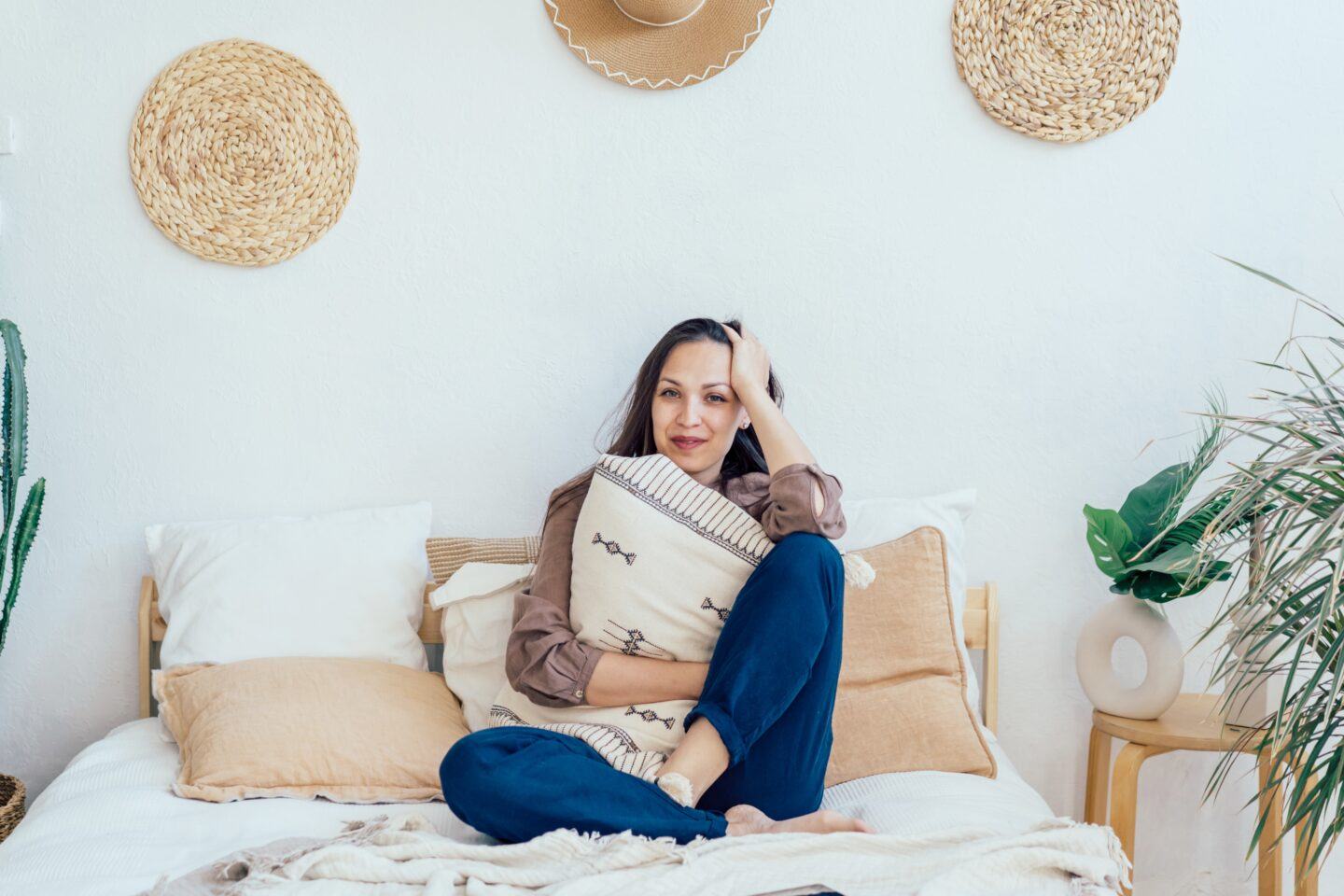 Here’s how to tell if you’re in perimenopause woman relaxing in bedroom