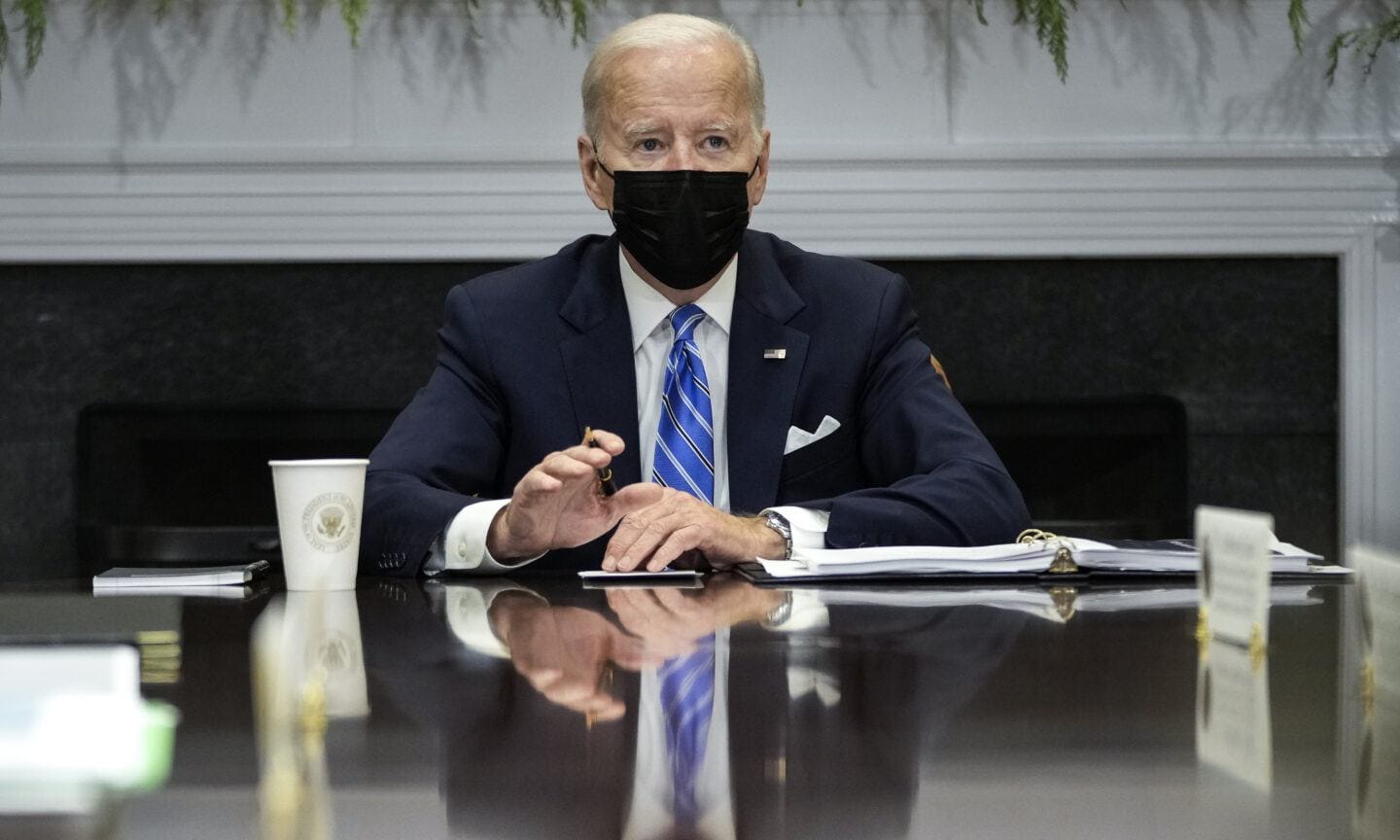 President Biden will offer 500 million free Covid tests to all Americans President Biden wearing a mask at White House desk