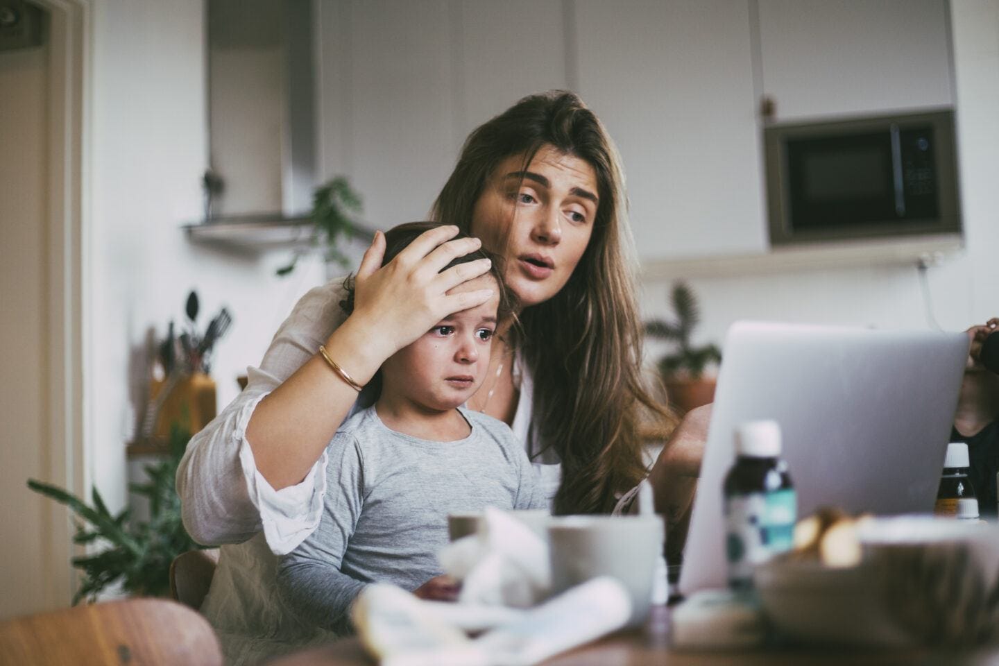 The best pediatric telehealth platforms for kids—and moms Mother with sick son taking advice on video call at home during pediatric telehealth visit
