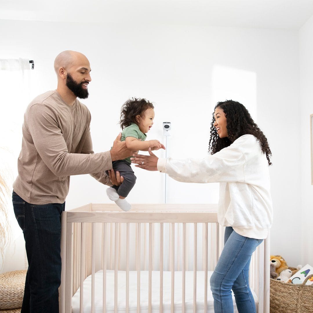 This smart baby monitor is a much better alternative to sleeping with one eye open Happy Family in Nursery With Miku Baby Monitor