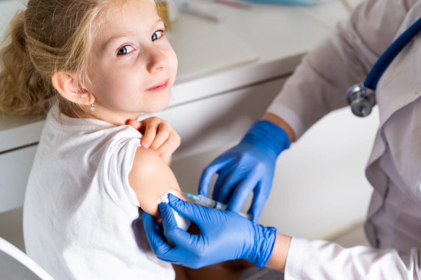 CDC approves both Pfizer and Moderna’s pediatric Covid vaccines for kids under 6 young girl getting vaccinated in doctor's office