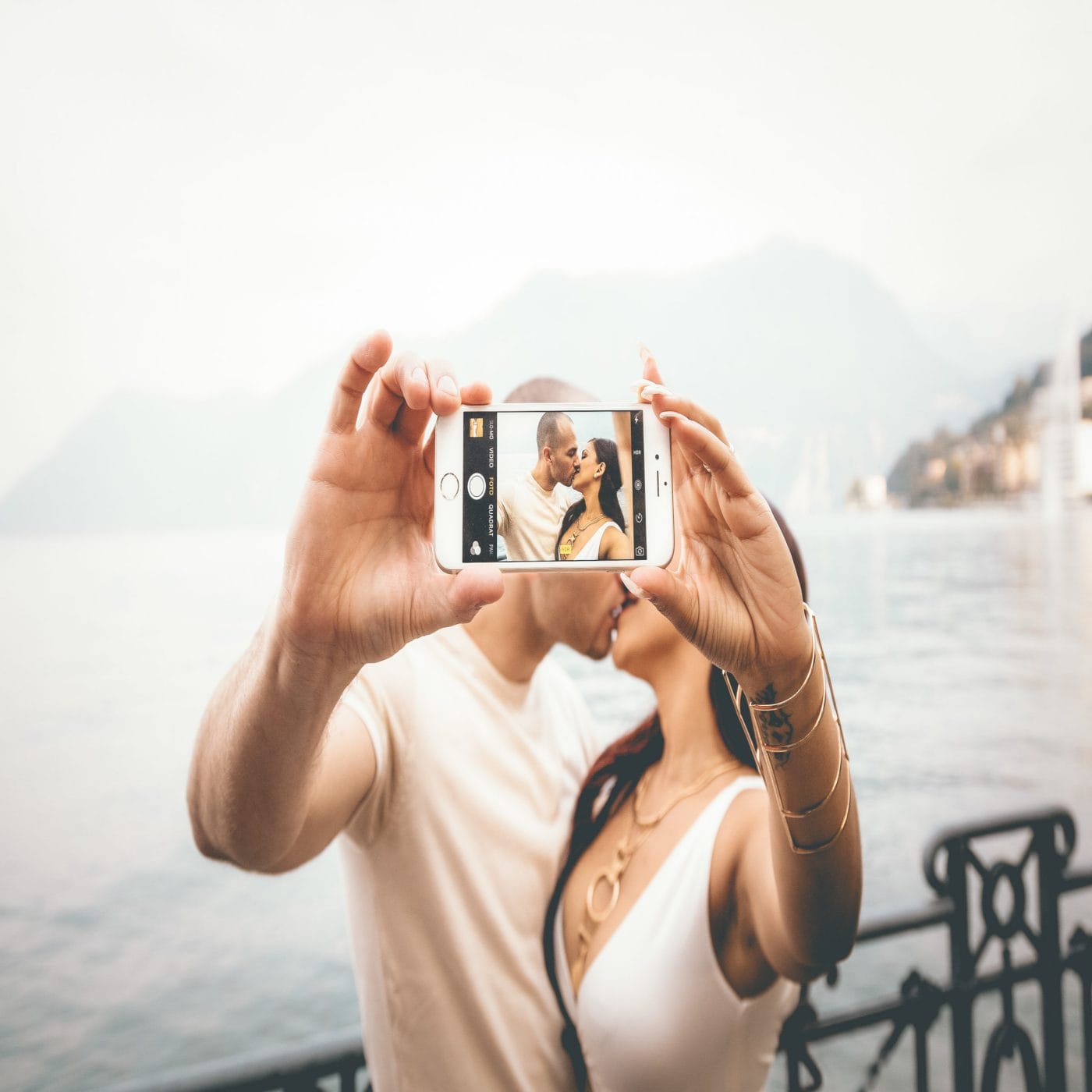 First trip without your baby? 6 tips to make for smooth travels couple kissing in selfie