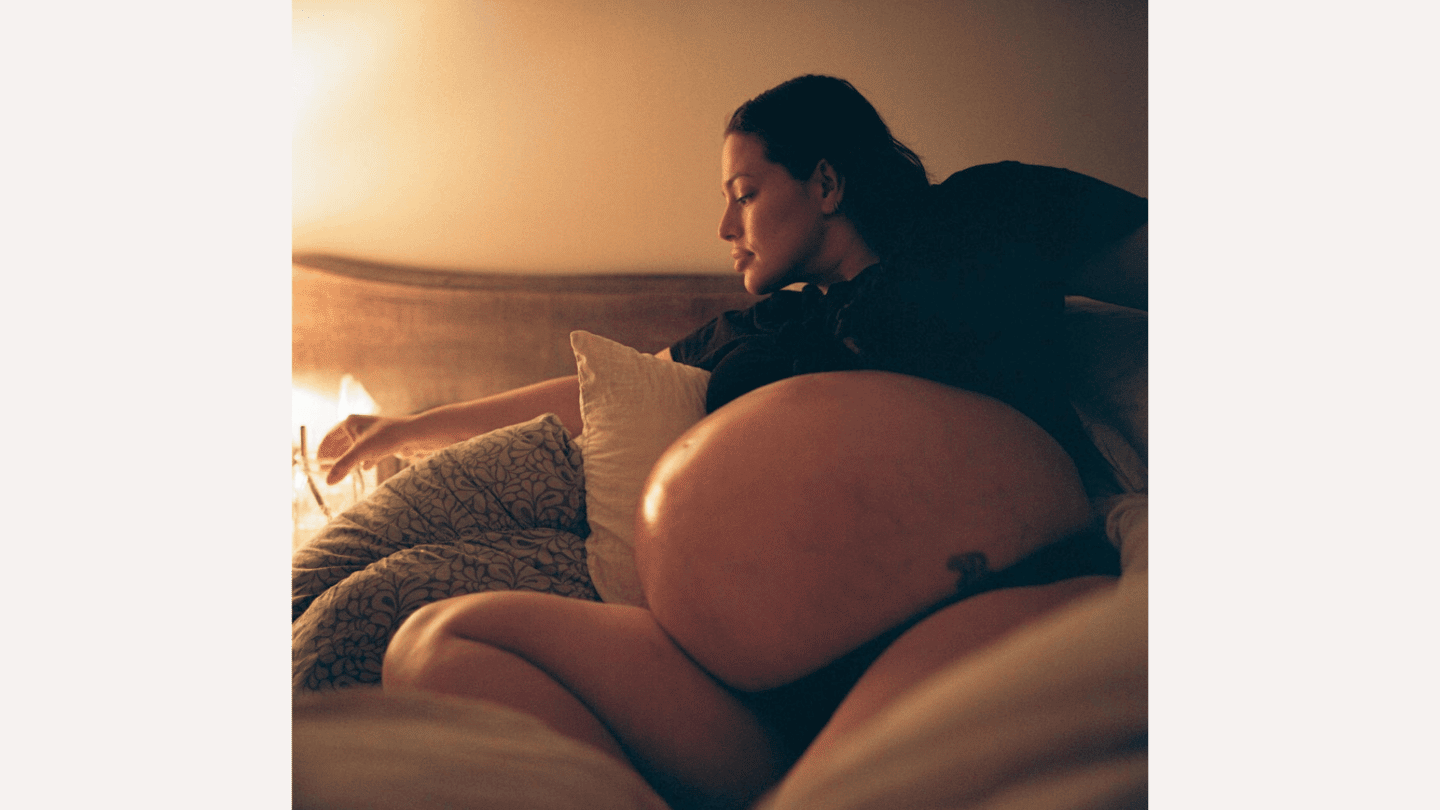 Ashley Graham celebrates reaching 40-week mark with twins Ashley Graham sitting on a bed while pregnant with twins