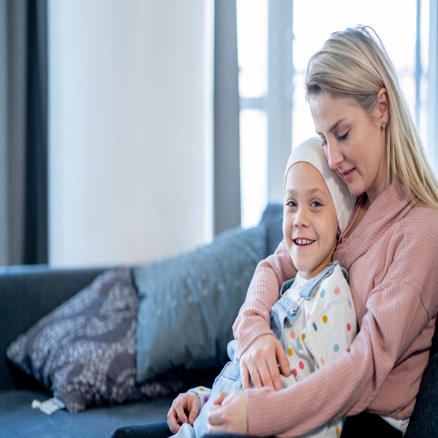 How to talk to kids about cancer treatment at any age Mother Embracing Her Daughter with Cancer