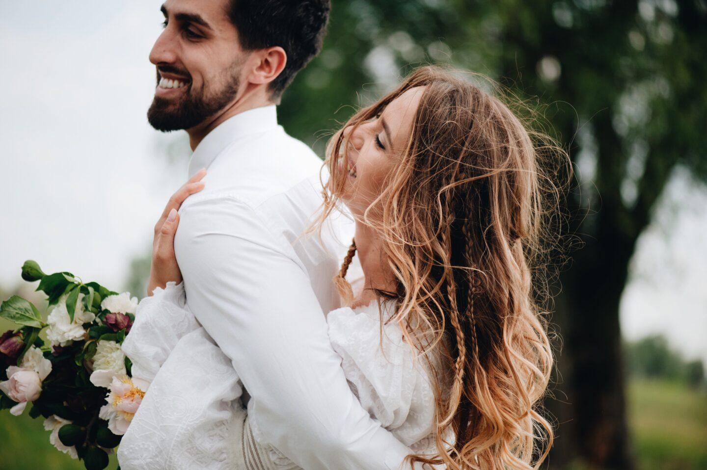 I miss how easy and fun sex was before my infertility struggles sex after infertility: couple happily embracing on wedding day