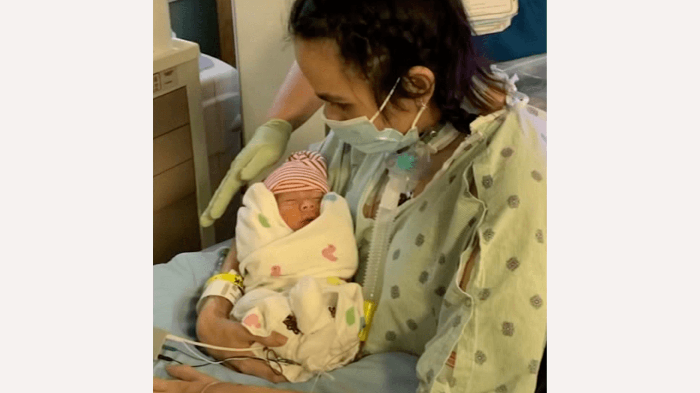 This mom gave birth after surviving Covid, a heart attack, and 3 strokes while pregnant Mom holding baby after Covid, heart attack, and stroke