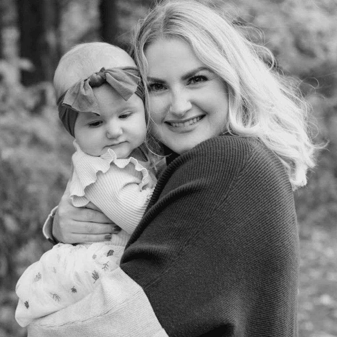Maggie on advocating for herself and her baby after opting for a vacuum birth mother holding baby close outside - essay on a vacuum birth