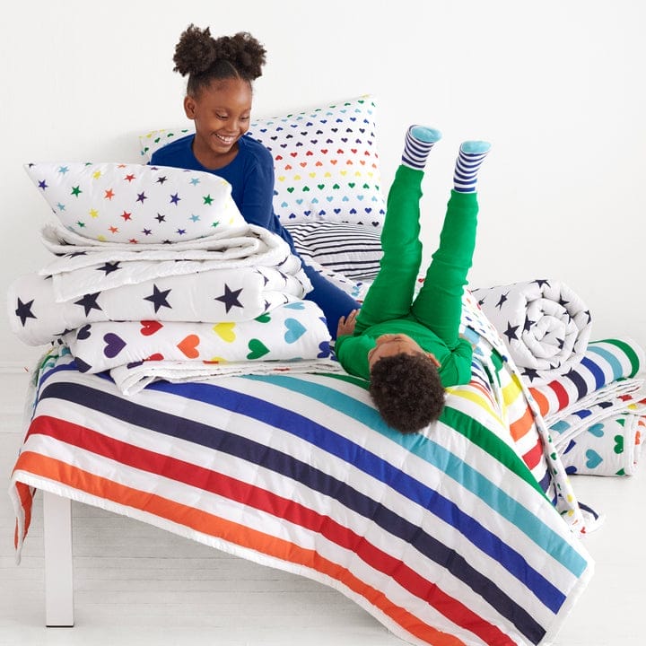 Primary–our go-to for kids’ clothing basics–just launched the cutest rainbow-hued bedding primary kids bedding