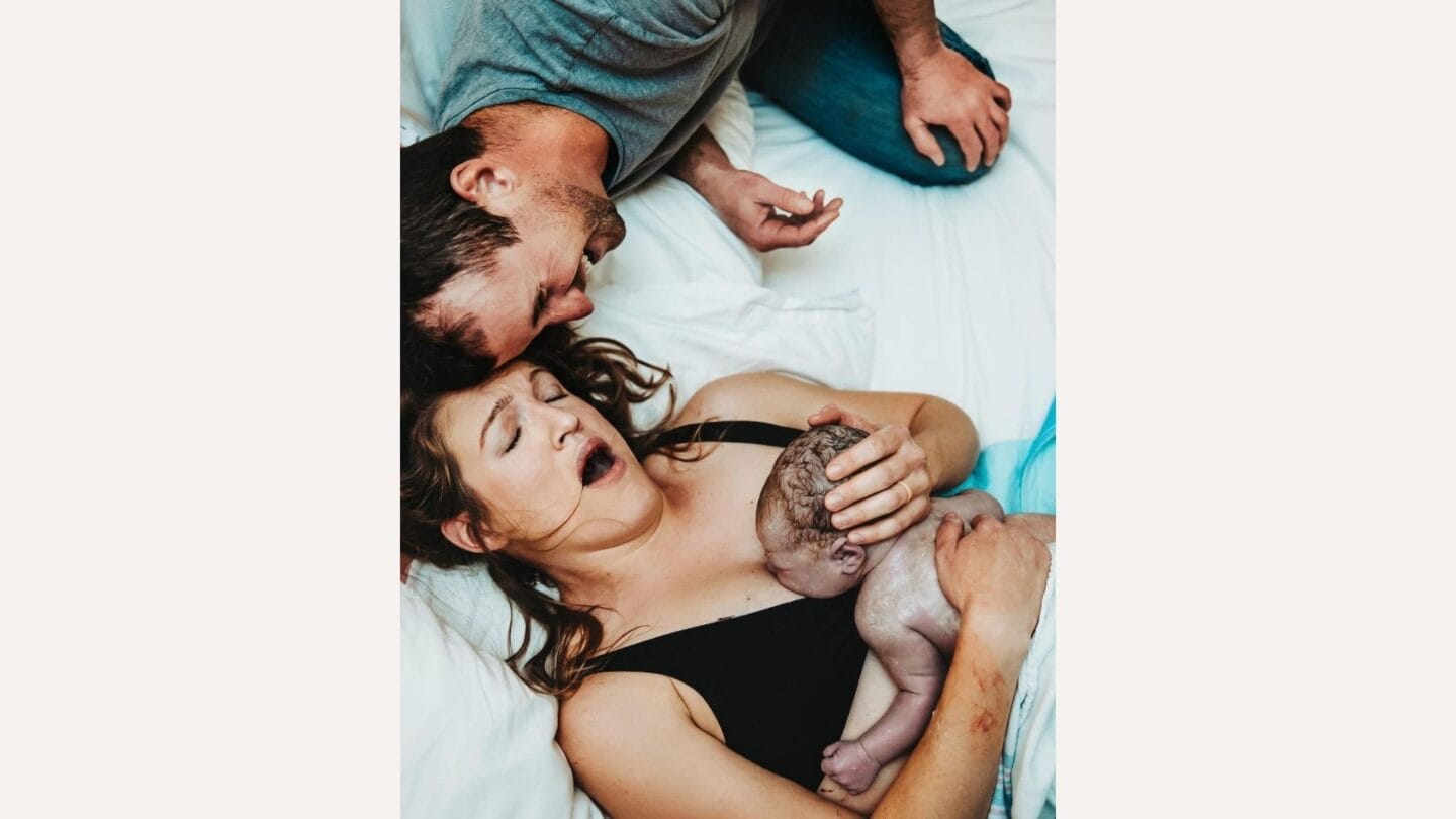 Mamas in Ukraine—and around the world—achieve the impossible photo of father with mother holding baby after giving birth