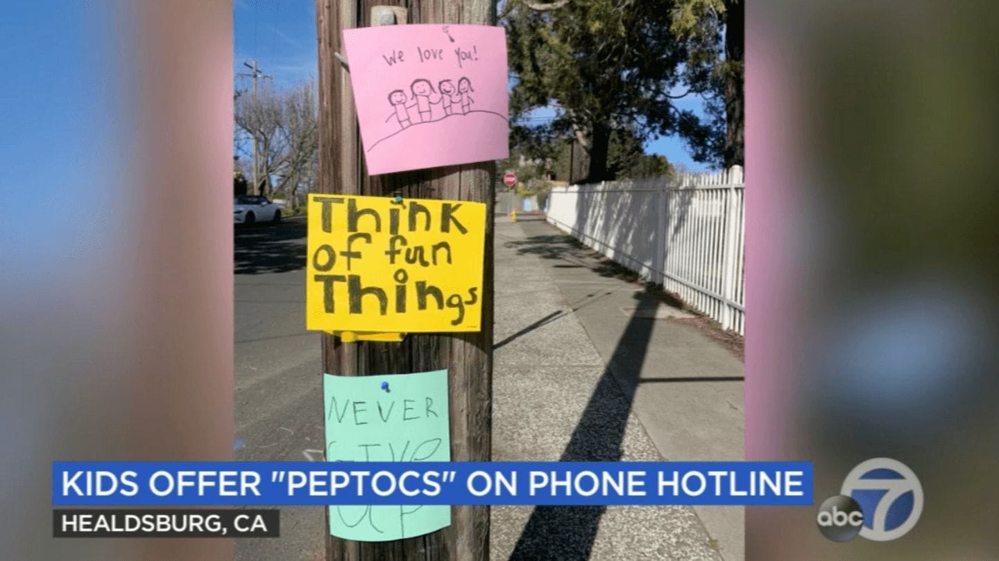 Feeling down? Call this hotline for a sweet pep talk from kindergarteners Pep Talk hotline signs on telephone pole
