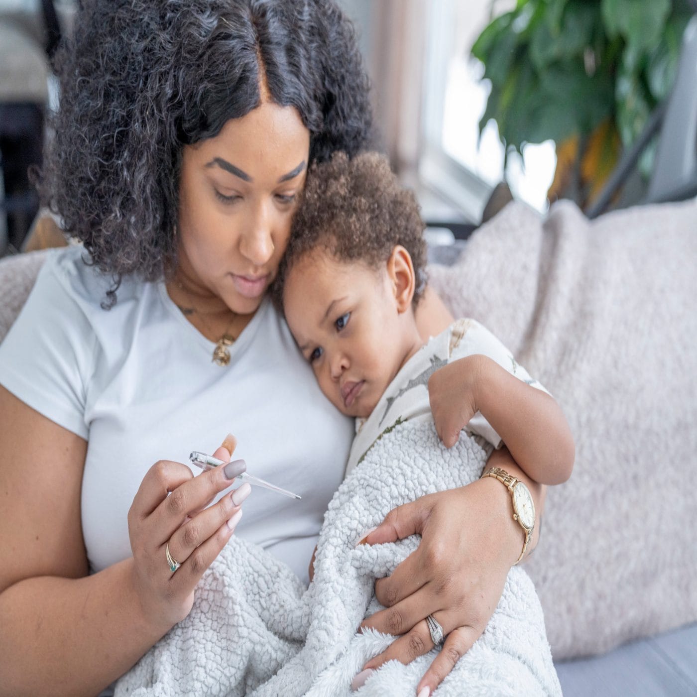 Croup is now a symptom of Covid in kids croup: mother holding sick child