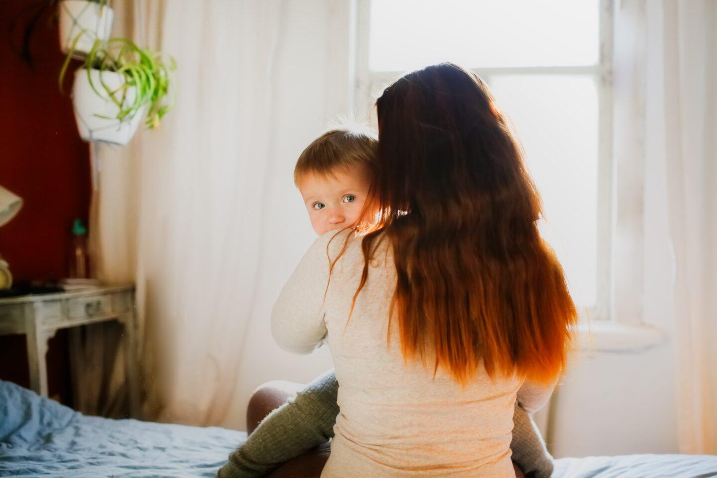 Here’s the truth, mama: We never stop needing our village Find a Village: sad mom holding baby