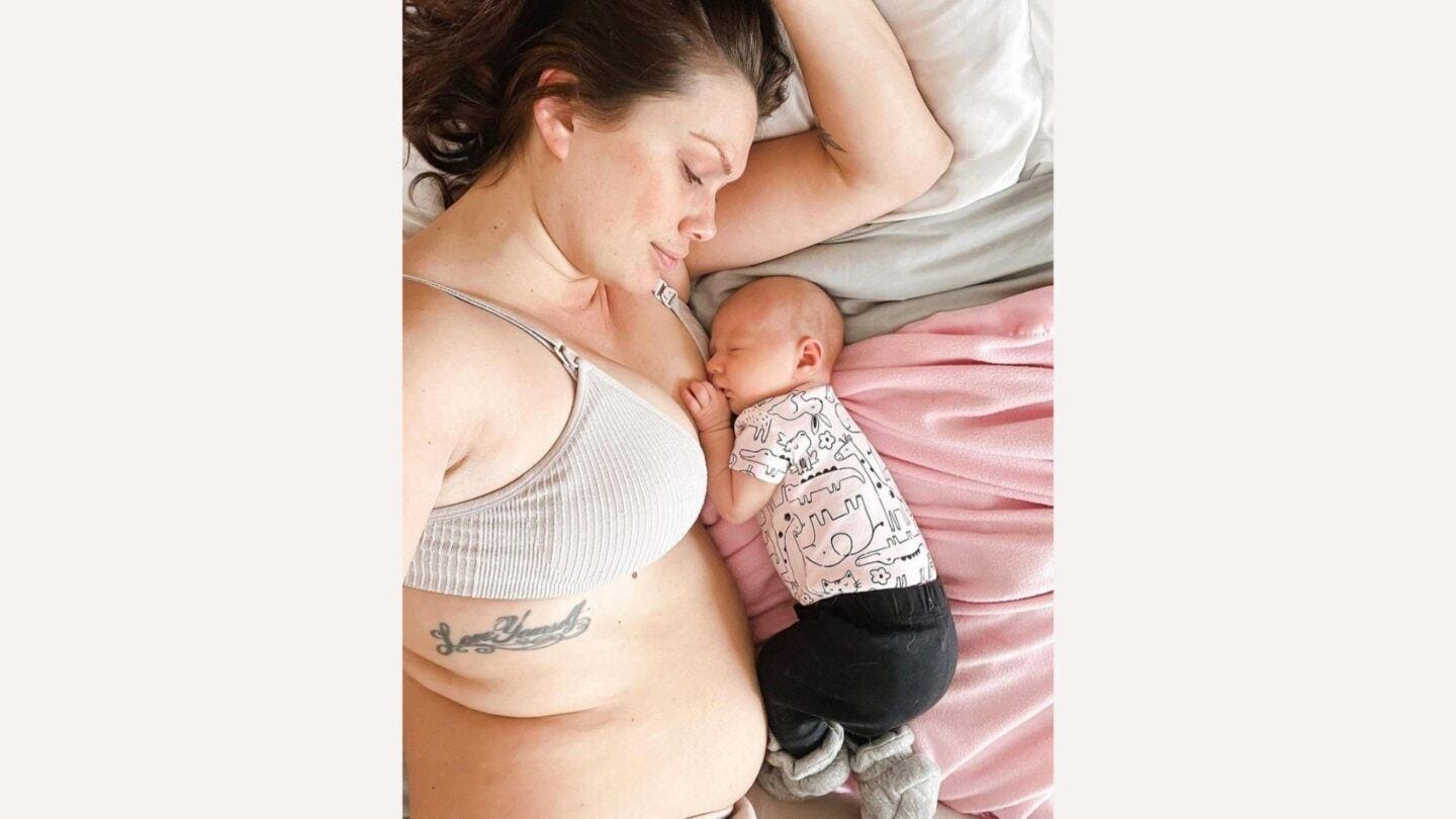 One mama’s moving post about bounce-back culture: “We’re growing forward” mama and baby lying on bed