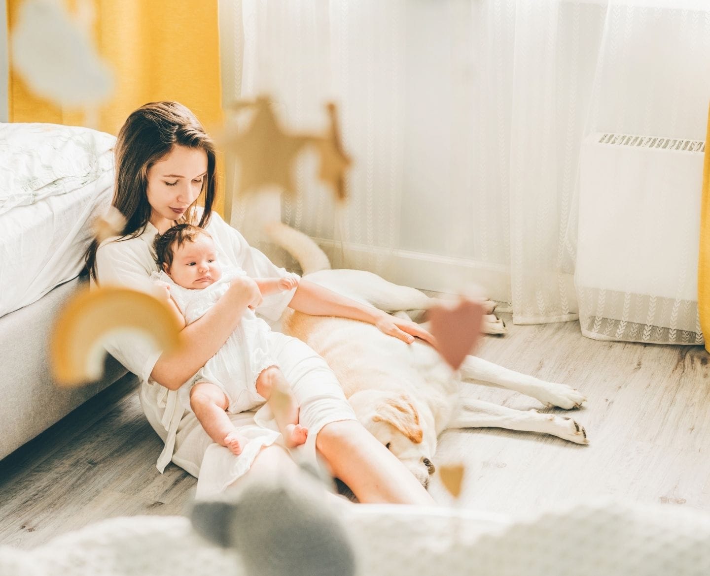 Sleep training didn’t work for us, and that’s OK sleep training: mother sitting on floor holding baby