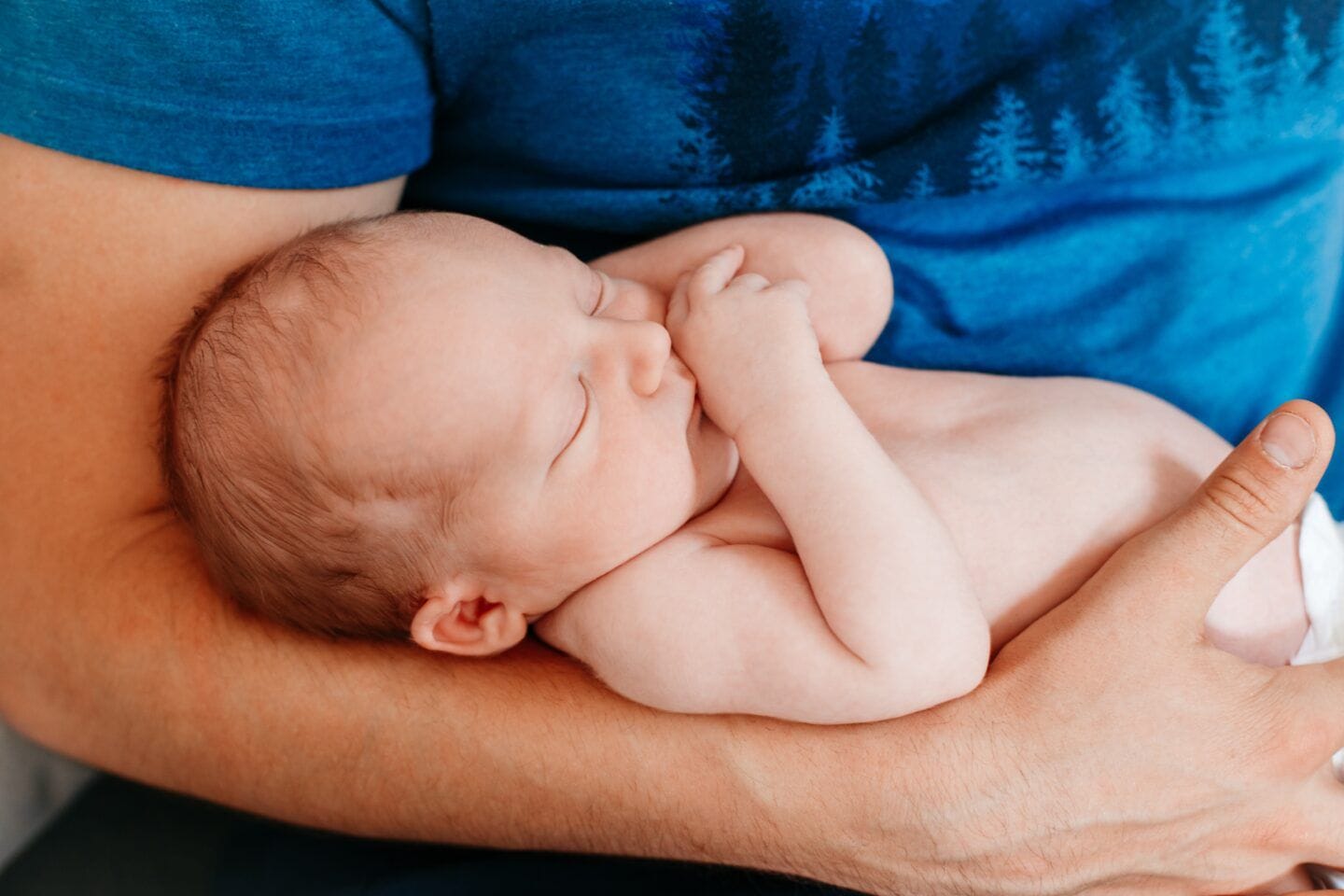 Diabetes drug in fathers could raise risk of birth defects in babies father holding newborn baby in arms