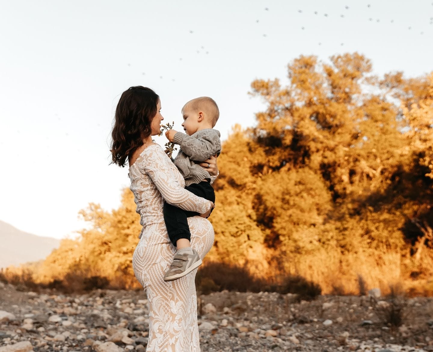 I didn’t know it was possible to have postpartum anxiety without delivering a baby—until it happened to me postpartum anxiety: pregnant woman holding toddler