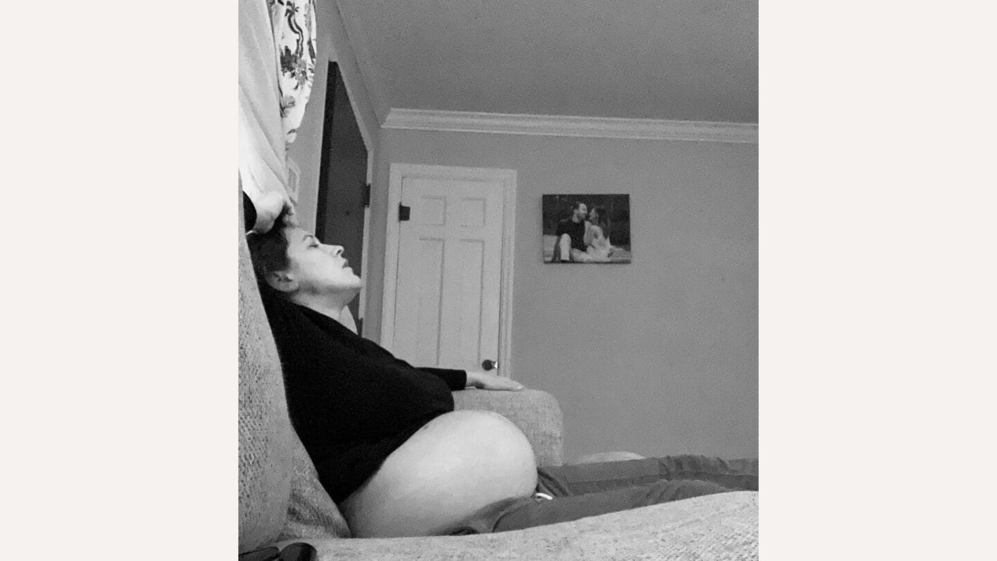 This mama’s message on becoming a mom of two will have you in your feelings mom of two: pregnant woman sitting on couch