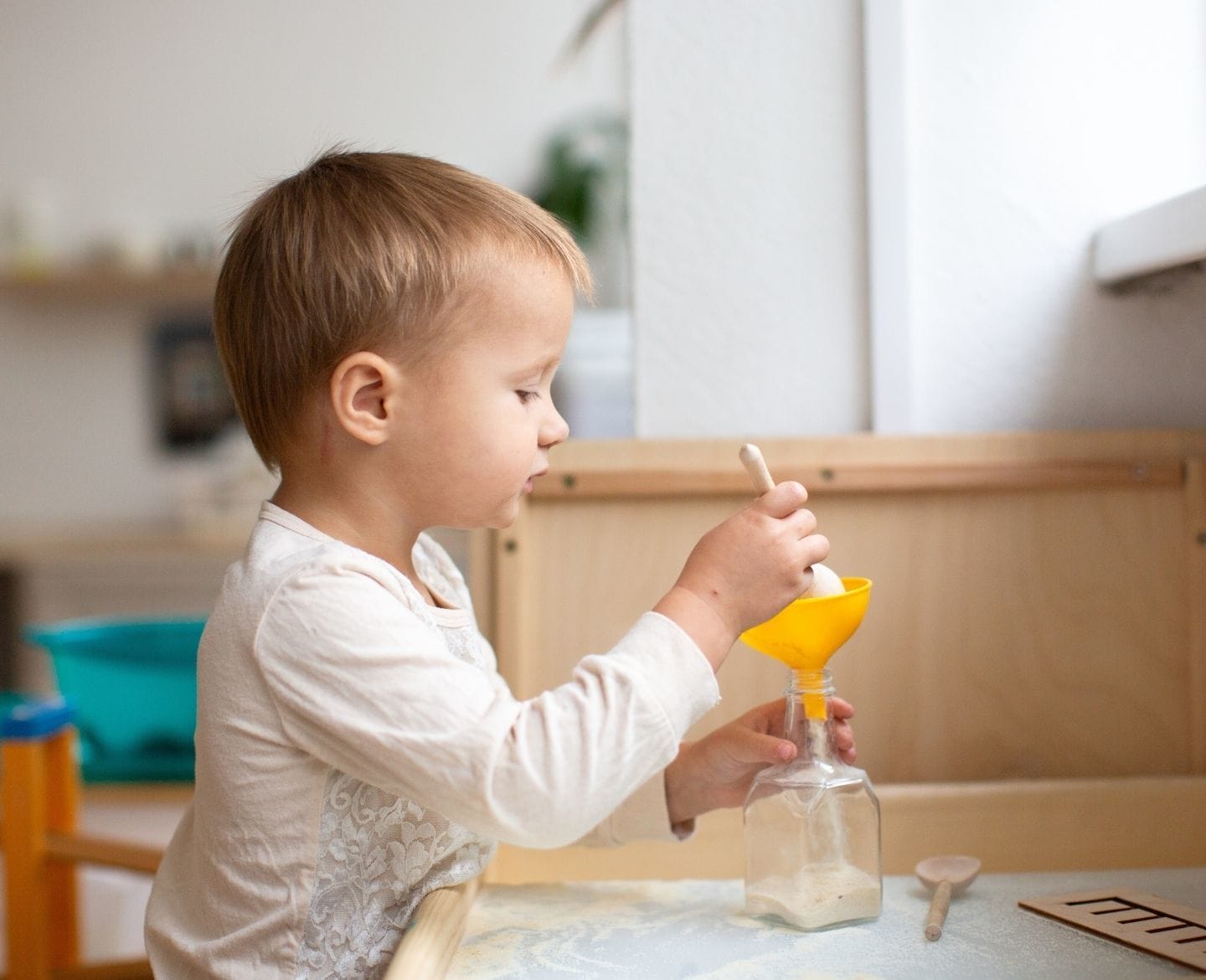 35 sensory play activities to stimulate your toddler’s beautiful brain toddler sensory activities with funnel- sensory activities for toddlers