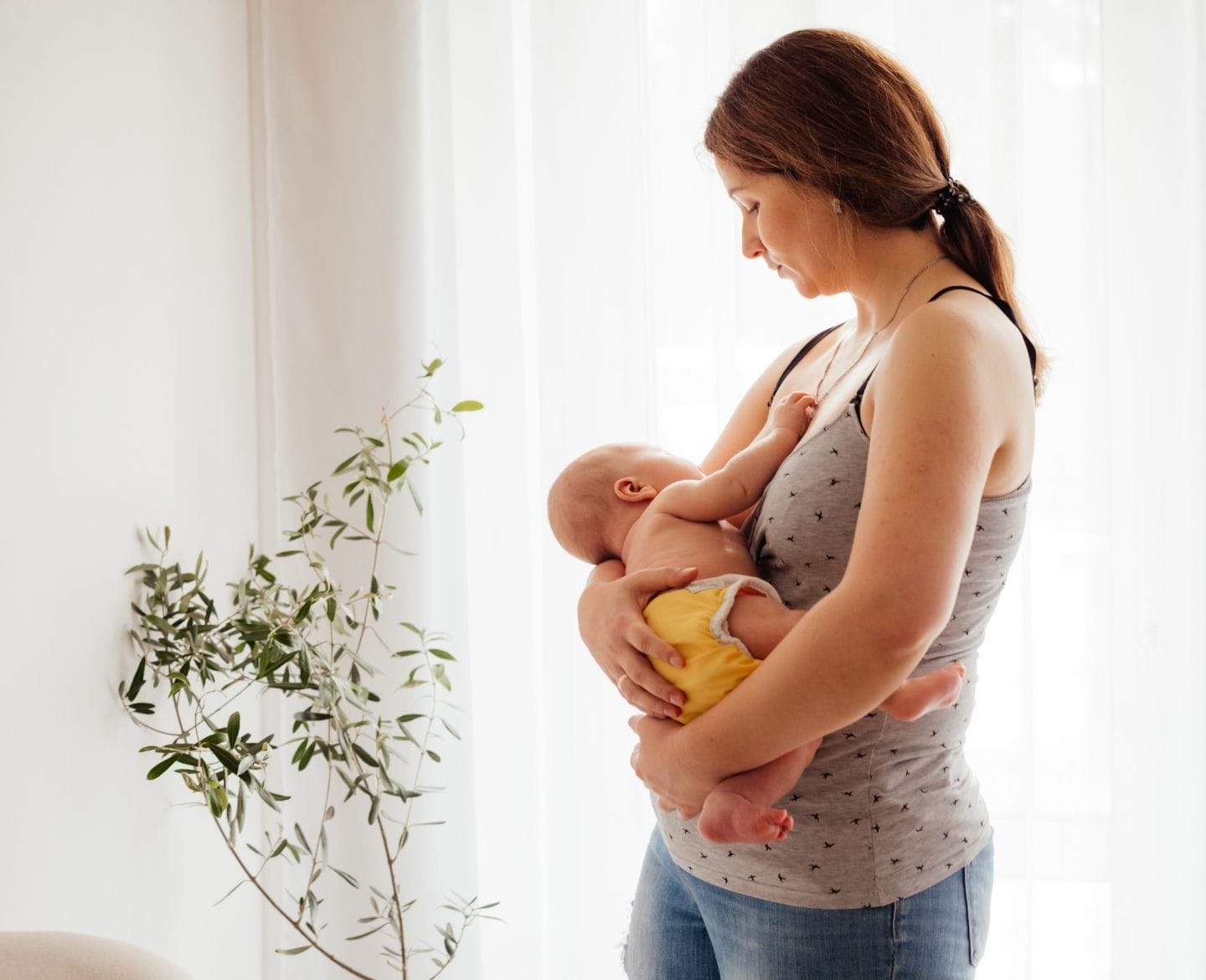 Yes my body has changed—but it’s not open for your comments postpartum body image: woman holding baby
