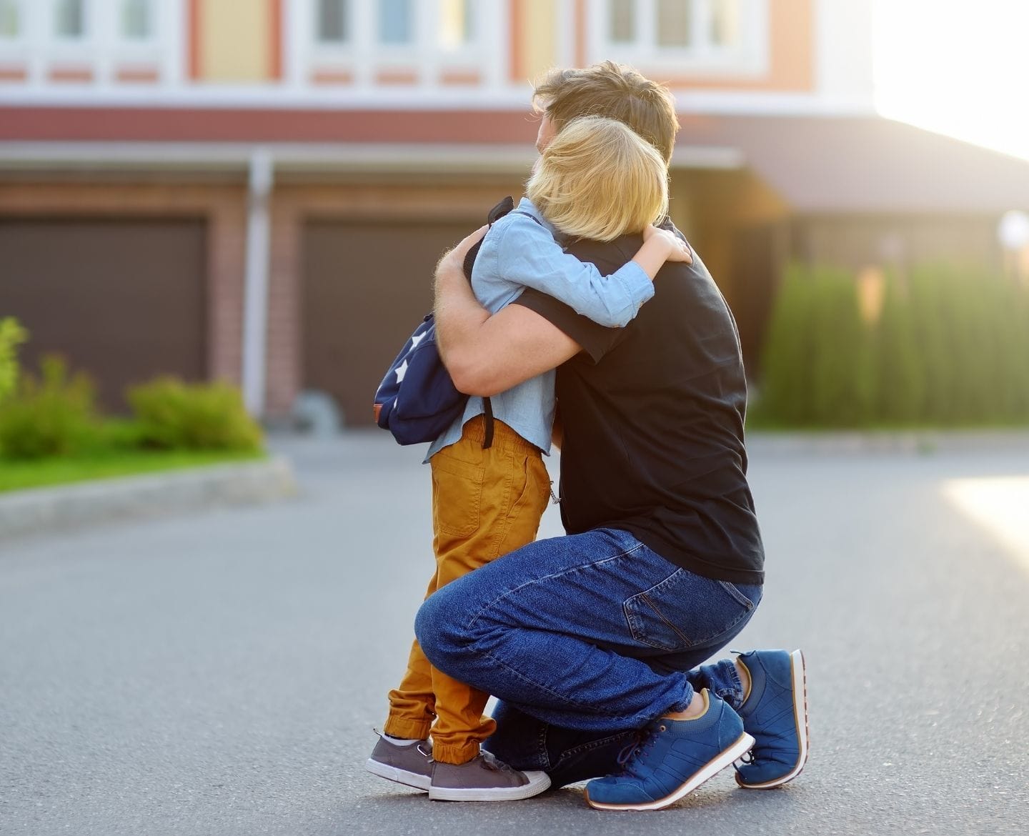 Gun violence is the leading cause of death in children. How can we talk about anything else? father hugging son at school