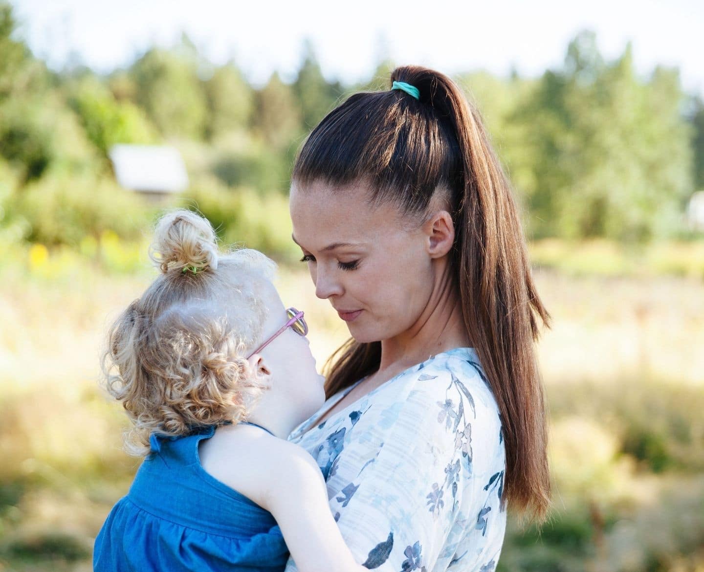 My daughter and I both have a disability—and I still struggle with ableism mother holding daughter