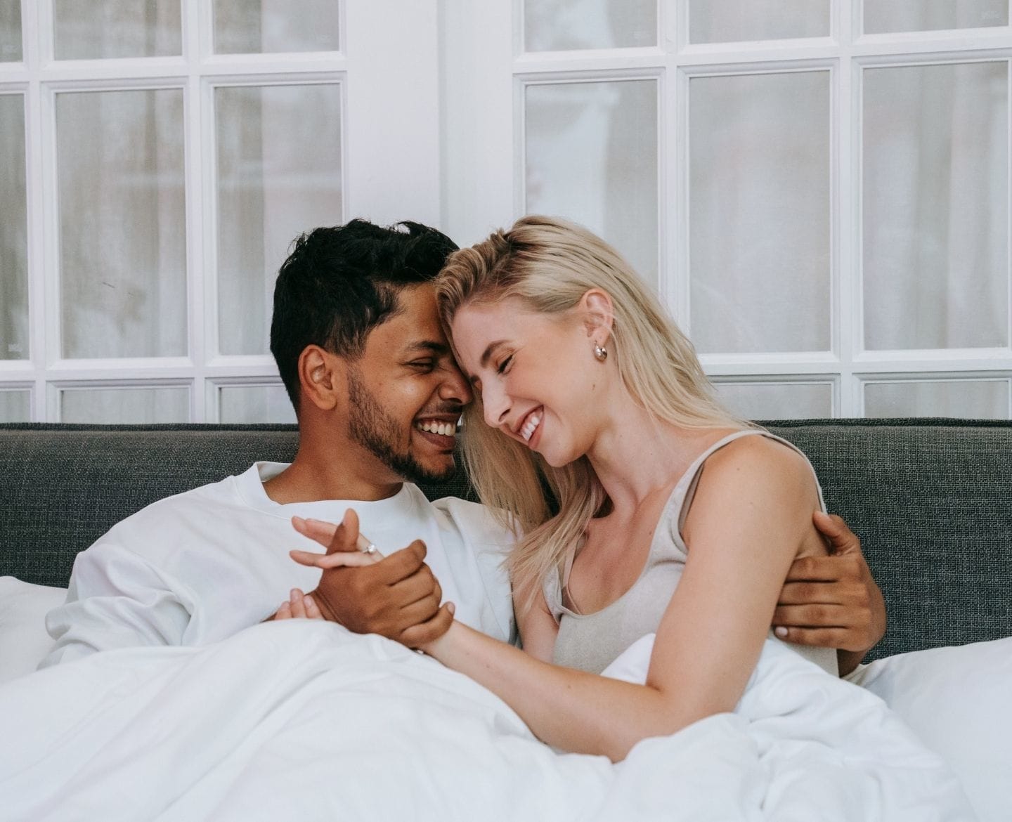 It’s Science: Taking a vitamin C supplement may put you in the mood couple cuddling in bed