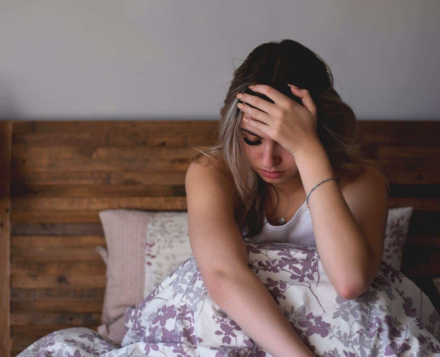 What overturning Roe v. Wade could mean for women who experience miscarriage and pregnancy loss sad woman in bed