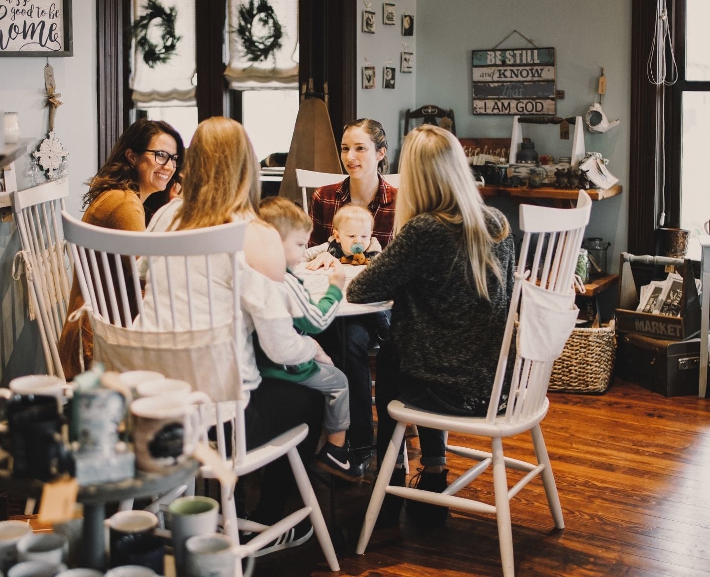 The village is there, but you might have to look for it raising kids without a village: group of moms and babies sitting around table
