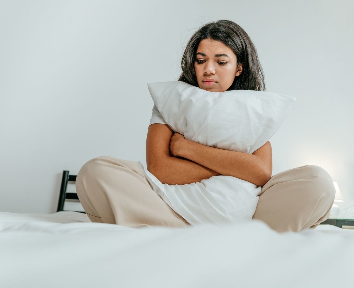 If news of pregnancy loss stirs up miscarriage grief, you aren’t alone miscarriage grief: sad woman in bed