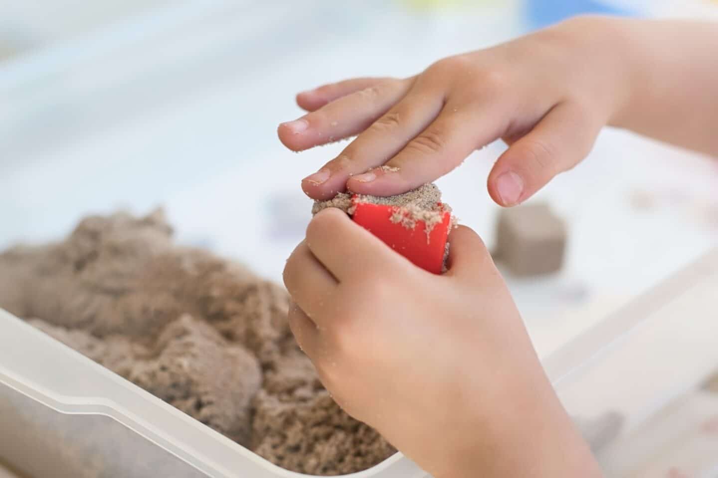 sand education learning fun child hands play kids sensory tactile t20 wLJ3g0 - Motherly