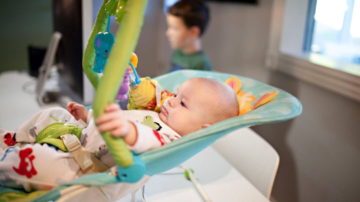 Fisher-Price issues a safety warning about rockers after 13 infant deaths Baby sitting in a Fisher Price rocker
