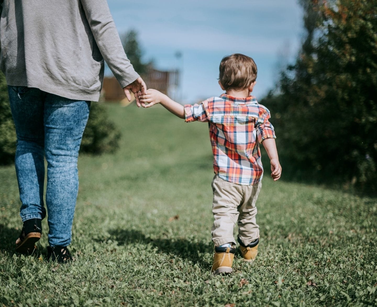 This is who I hope my children become despite our complicated world mom holding son's hand, walking