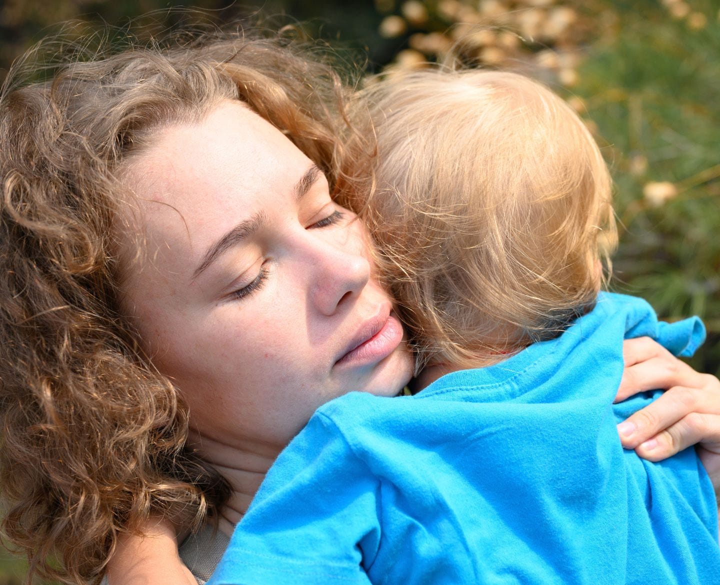 For our children, it’s time we stop forgetting mother comforting child