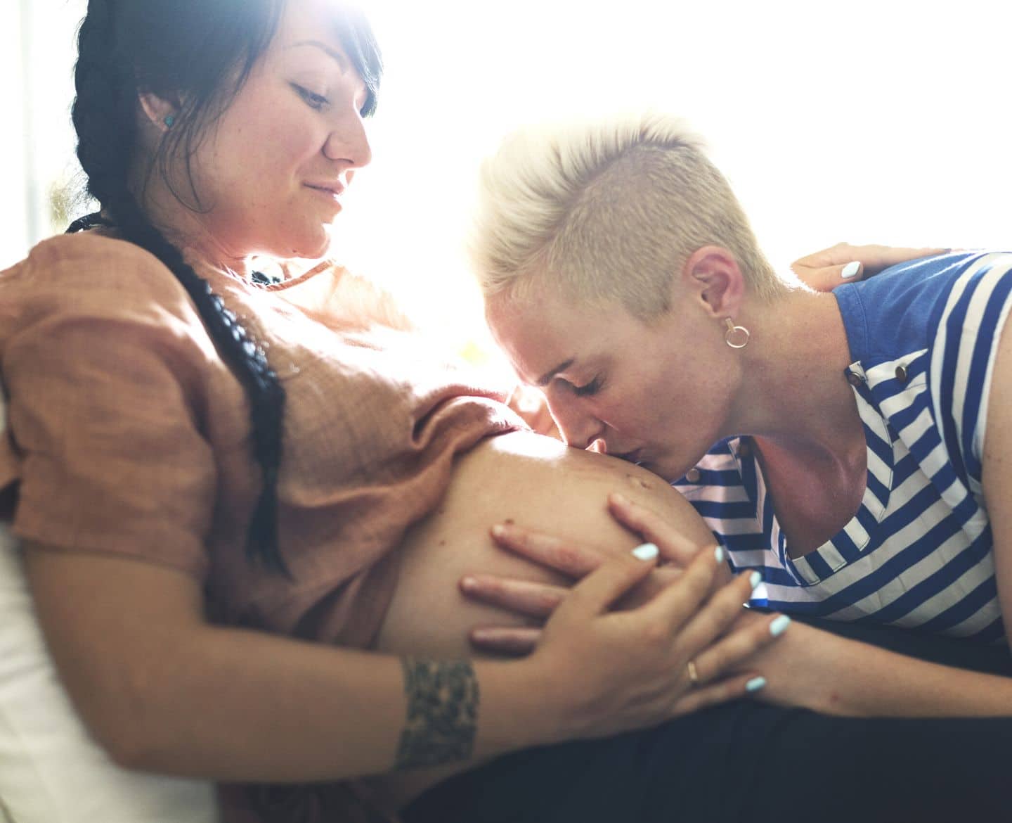Here’s why we need an expanded definition of infertility Pregnant LGBTQ+ couple - definition of infertility